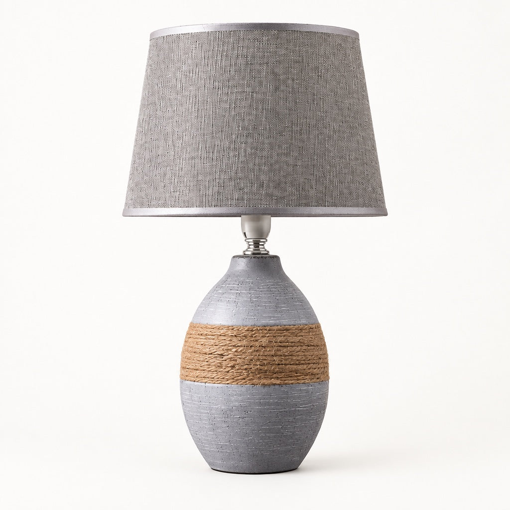 Grey egg-shaped ceramic table lamp with a rope band and a grey linen shade